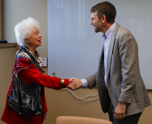 Dan Leroy greets legacy, Charlotte Lundsford Berry, in his office at the United Way office space. 
