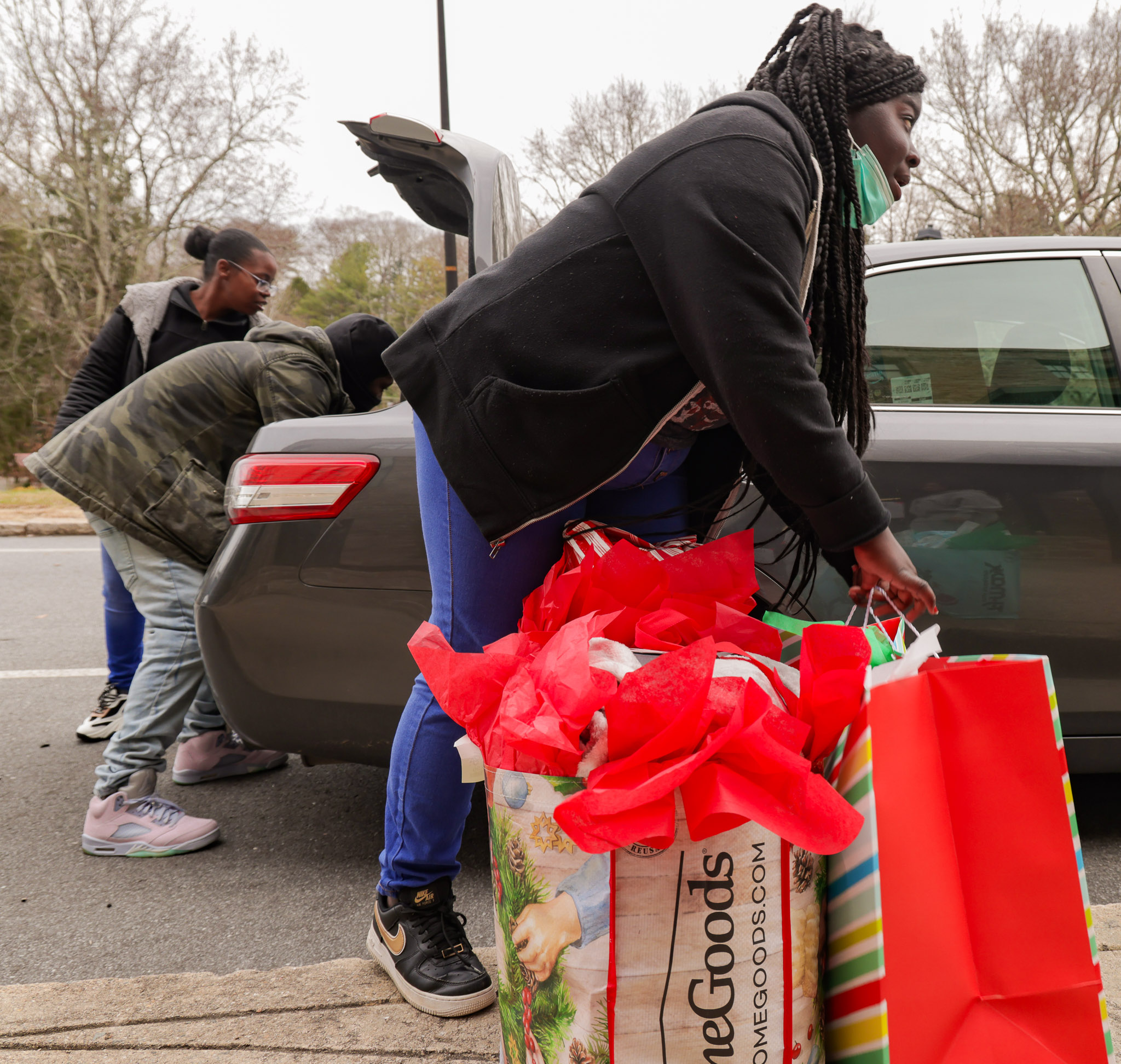 An Asheville High school student and familie pick up wrapped gifts. 