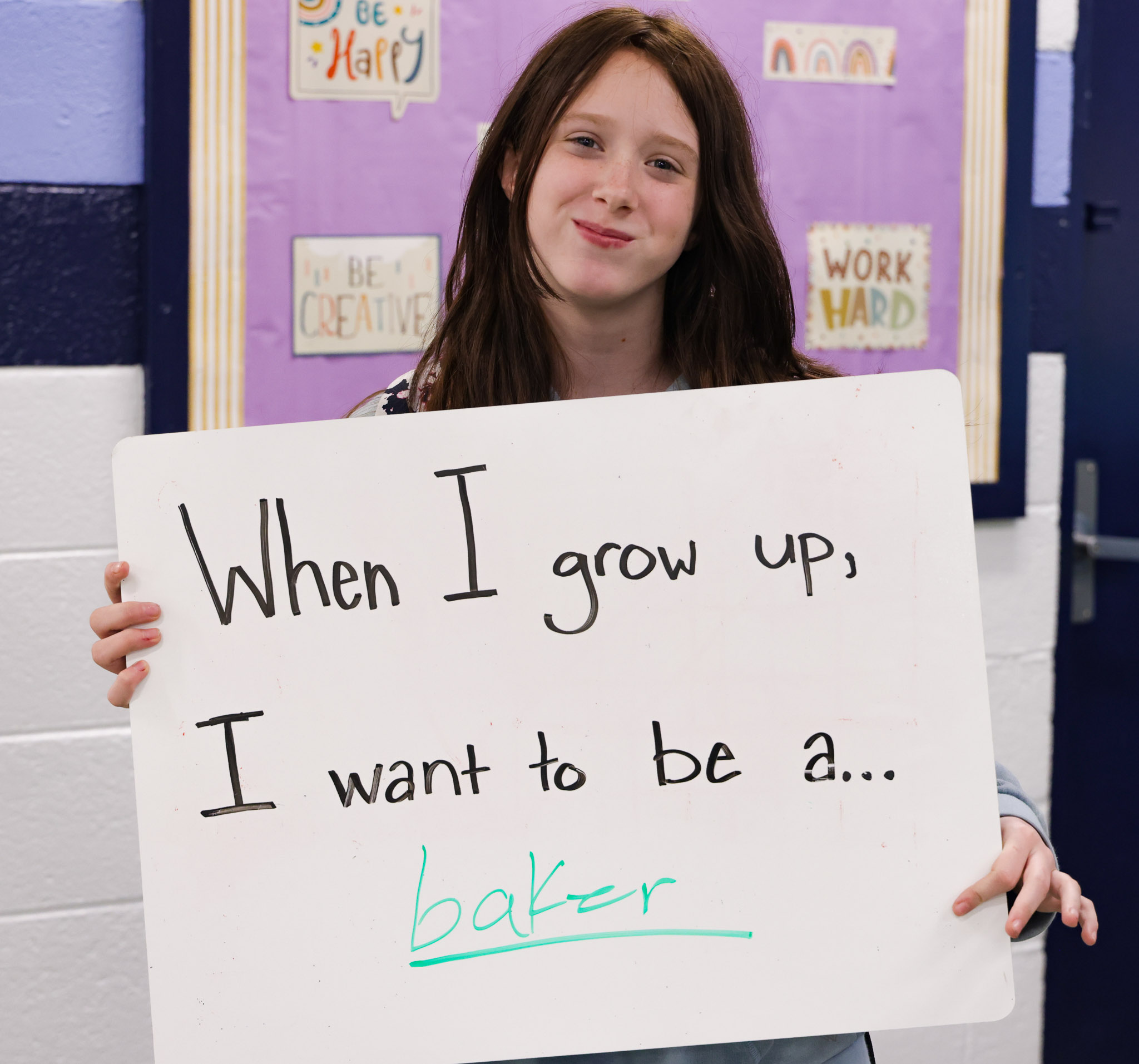 An Enka Middle student poses for a photo during Career Week 2023. 