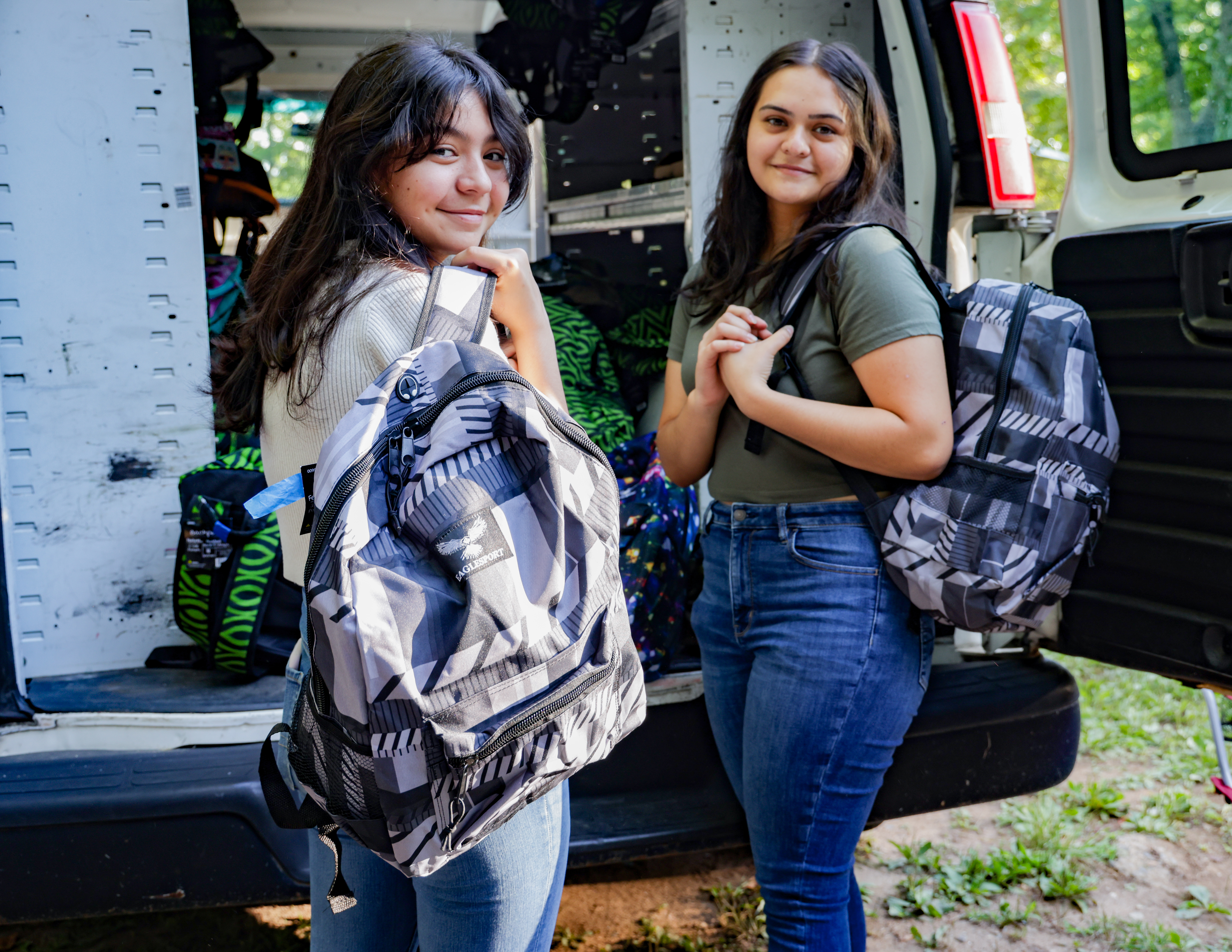 Two students get backpacks