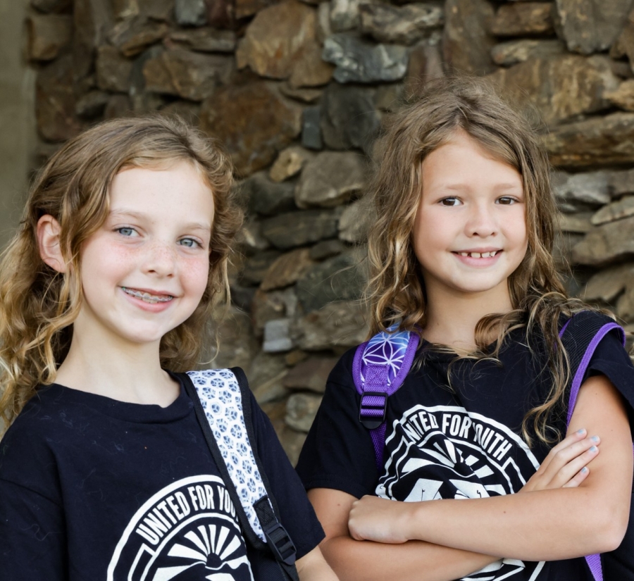 Students with backpacks at the School Supply Drive