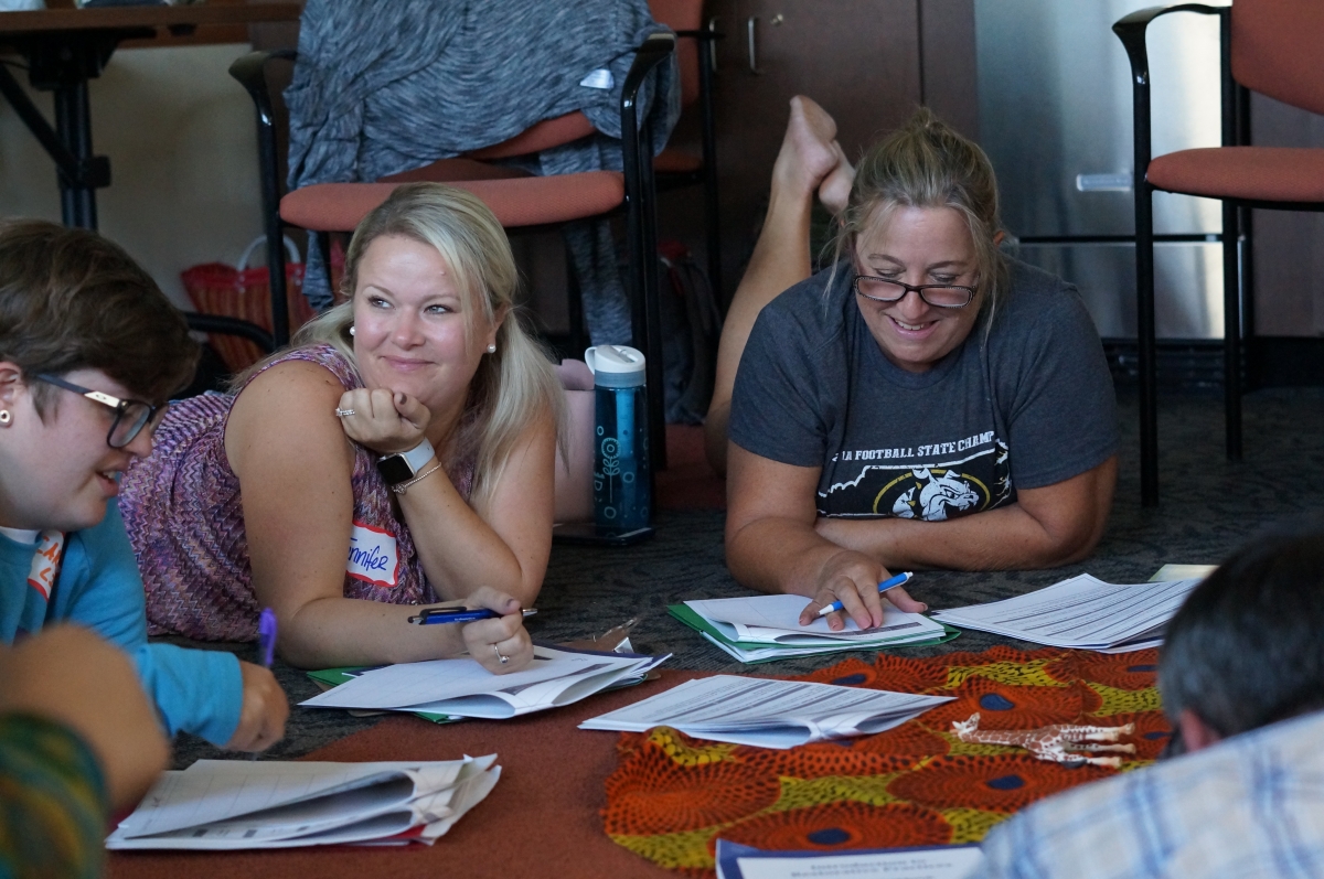 participants gather in small discussion groups