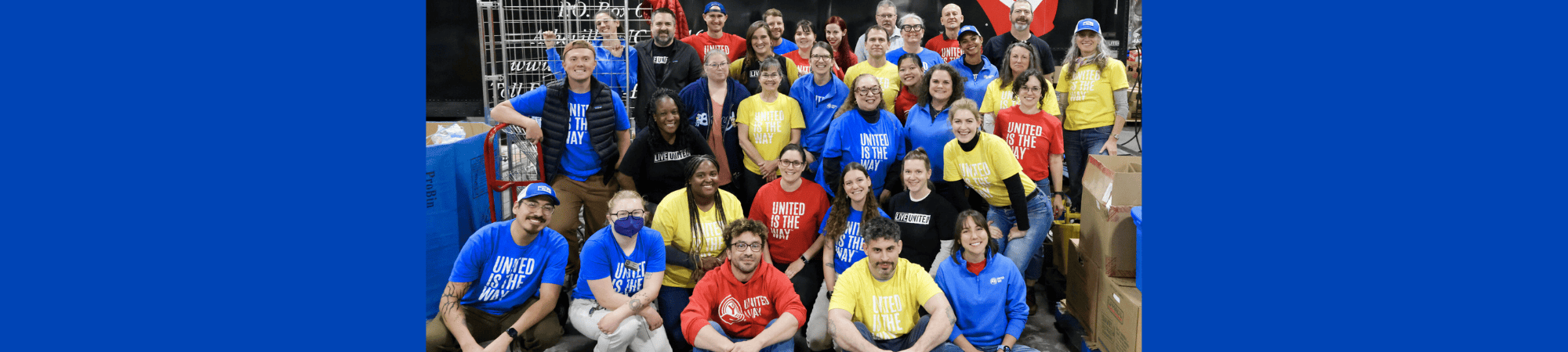 banner image with United Way staff members in a big group shot wearing "united is the way" tshirts.
