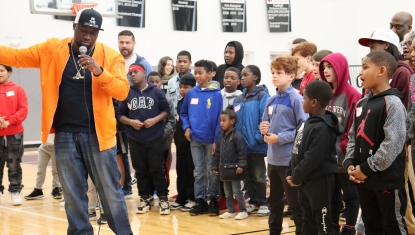 SaulPaul gives the children instructions for the Texas Two Step