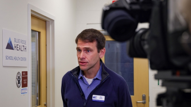 Dan Leroy, of United Way, shares information about School-Based Health Centers with the WLOS news crew. 