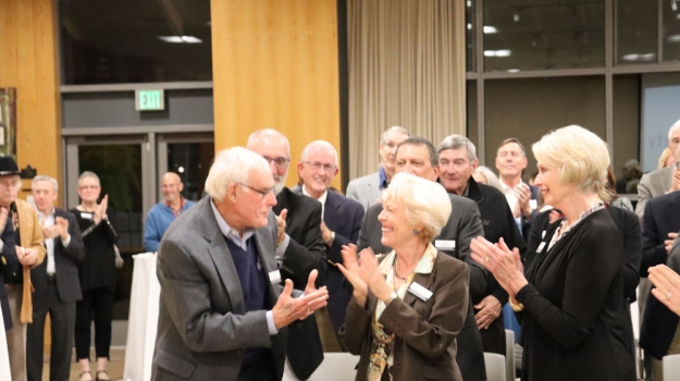 Surprised! Bob Burgin and his wife Glenda as he learns that he has been awarded the Order of The Long Leaf Pine by Governor Roy Cooper.