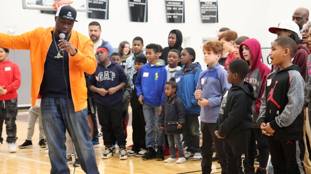 SaulPaul gives the children instructions for the Texas Two Step